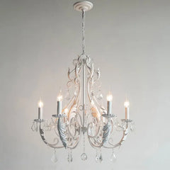 White chandelier with crystal accents on a plain background