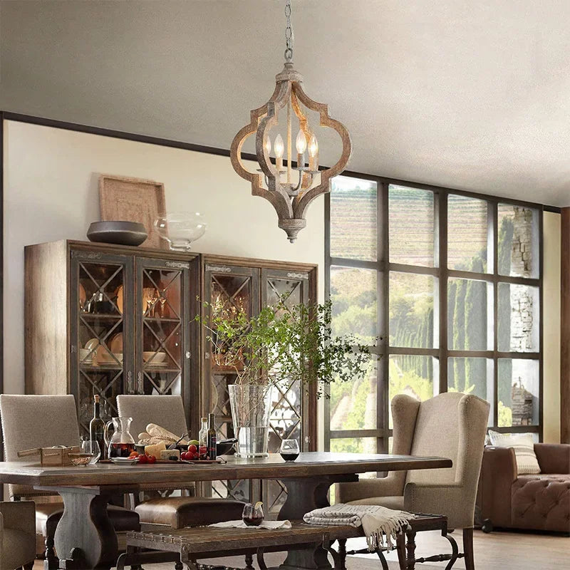 Dining room with wooden table, chairs, and a large window.