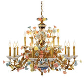 A gold chandelier adorned with numerous colorful ceramic roses and floral accents, featuring candle-style light holders.