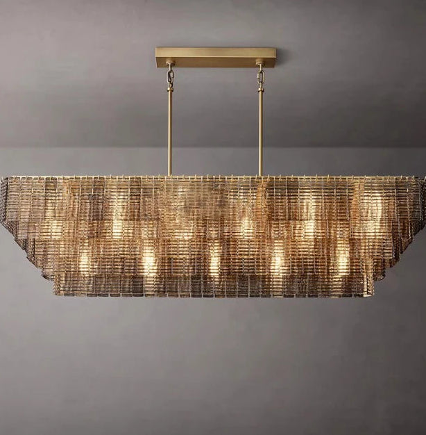 Modern chandelier with a metallic finish on a gray background