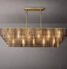 Modern chandelier with a metallic finish on a gray background