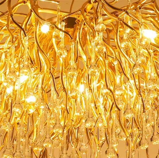Gold chandelier with intricate design on a beige background