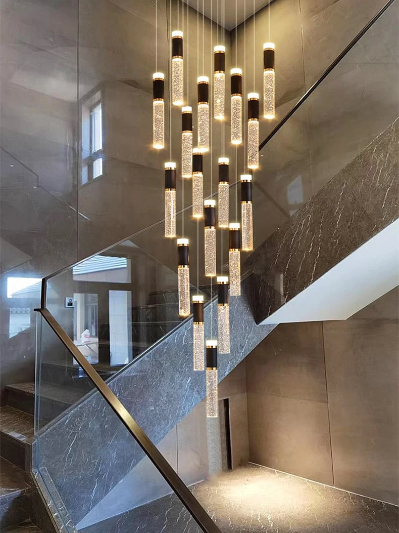 Modern staircase with a decorative chandelier in a stylish interior setting.