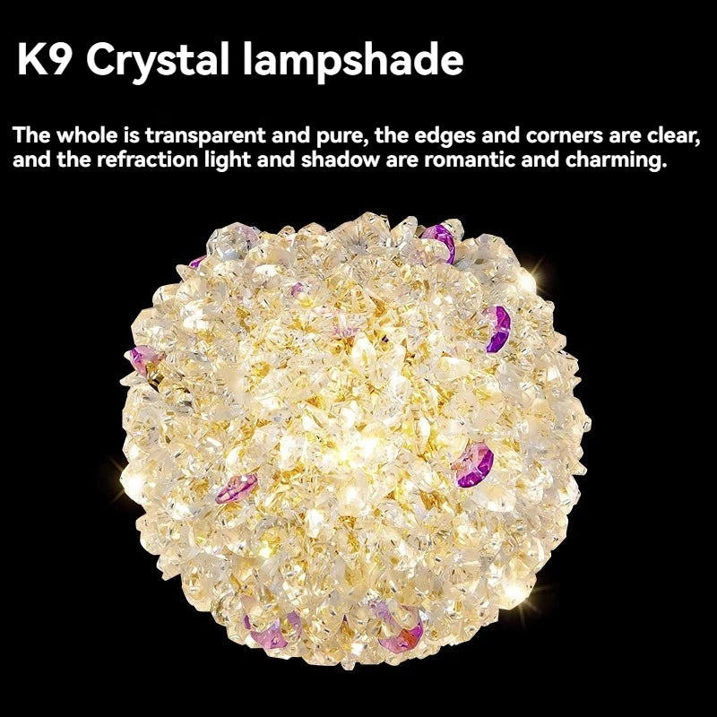 Close-up view of a gold crystal orb pendant light, showing K9 crystal details.