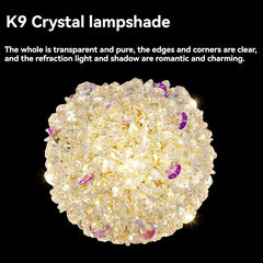 Close-up view of a gold crystal orb pendant light, showing K9 crystal details.