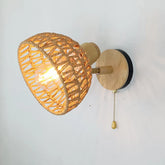 Woven wall light fixture with wooden frame on a white background