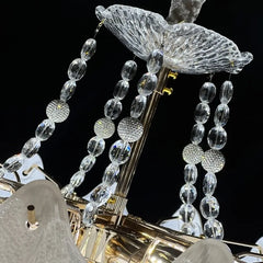 Detailed view of the crystal accents and metal frame of the chandelier