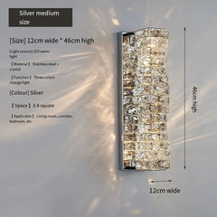 Silver wall light fixture with dimensions and features on a gray background