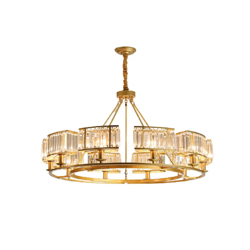 Gold chandelier with crystal accents on a white background