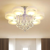 Close-up of a cascading crystal waterfall pendant light with a chrome finish against a plain background.