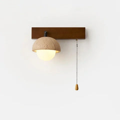 Wall-mounted light fixture with a wooden base and beige lampshade on a white wall.