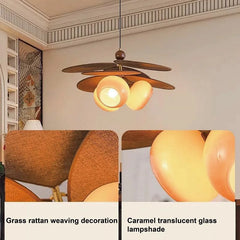 Ceiling light fixture with grass rattan weaving decoration and caramel translucent glass lampshade.