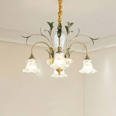 Side view of a gold floral crystal semi-flush chandelier