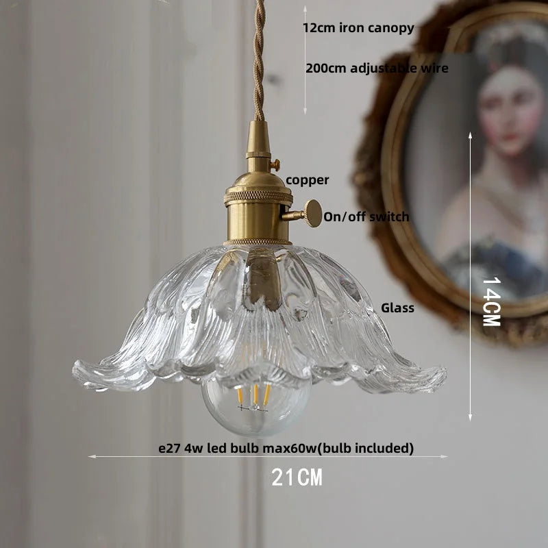Decorative pendant light with clear glass shade and brass fixture, shown with measurements.
