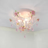 Pink floral rose semi-flush ceiling light mounted on a white ceiling, showcasing cascading pink crystals and rose accents.