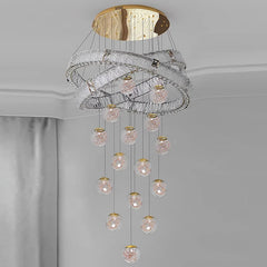 Chandelier with crystal balls and gold accents on a gray background