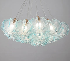 Modern chandelier with textured glass shades on a gray background