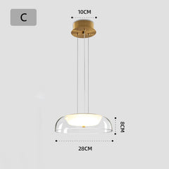 Gold pendant light with clear glass shade and dimensions on a white background