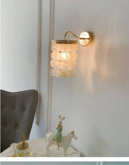 Gold Sconce with Tiered Capiz Shells and Wave Arm