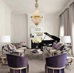 Luxurious living room with grand piano, chandelier, and purple chairs.