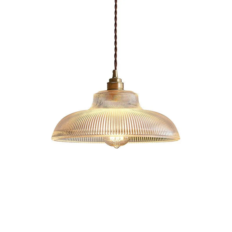 Pendant light with ribbed glass shade on a white background