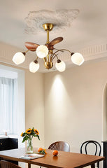 Modern ceiling light fixture in a dining room with a table and chairs.