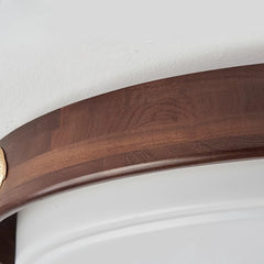 Wooden ring with a gold accent on a white background