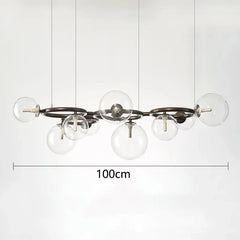 Modern chandelier with six glass bulbs on a white background, featuring measurement text.