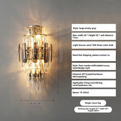 Wall-mounted crystal light fixture with dimensions and specifications on a gray wall.
