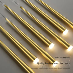 Gold cabinet handles on a gray surface with text about quality hardware and iron work.