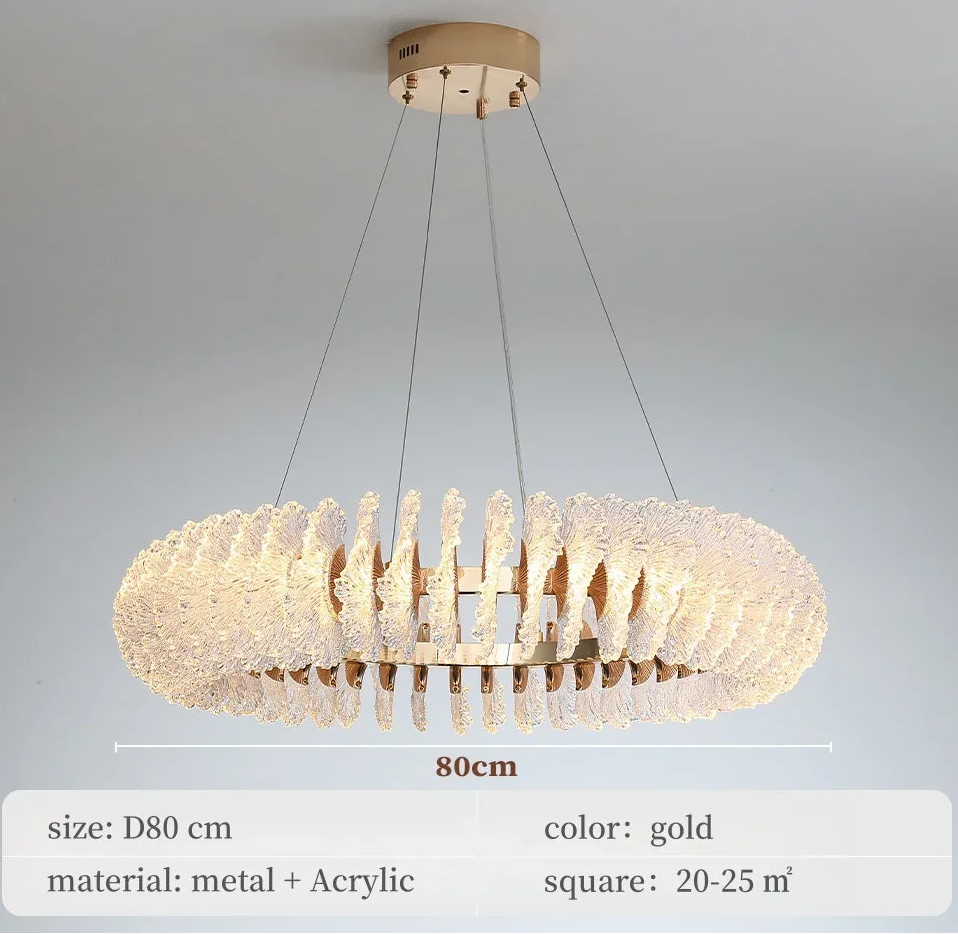Gold chandelier with dimensions and material details on a gray background