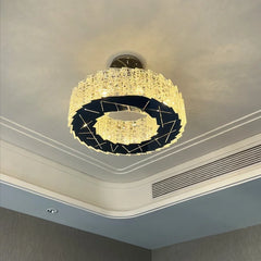 Close-up of the textured faceted crystals on a modern spiral flush mount chandelier.