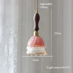 Decorative pendant light with measurements on a plain background