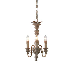 A standalone view of a distressed wood candelabra pendant light with three light sockets against a clean white background.