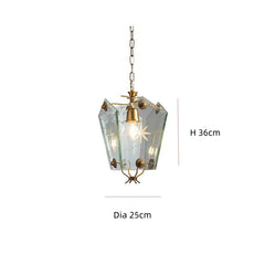 Pendant light with gold accents and clear glass shade on a white background