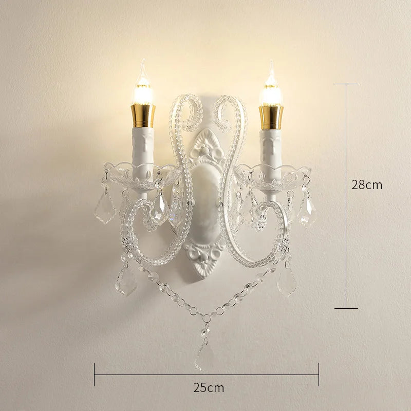 Decorative wall sconce with crystal details and dimensions on a plain background