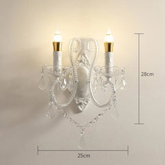 Decorative wall sconce with crystal details and dimensions on a plain background