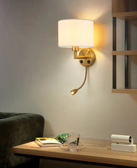 Wall-mounted lamp with a swiveling arm in a room setting.