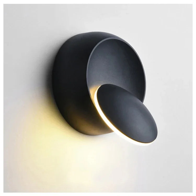 Modern black wall light fixture on a white background