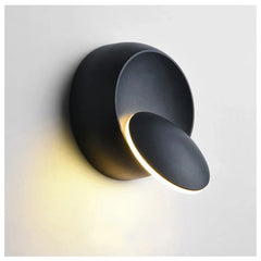 Modern black wall light fixture on a white background