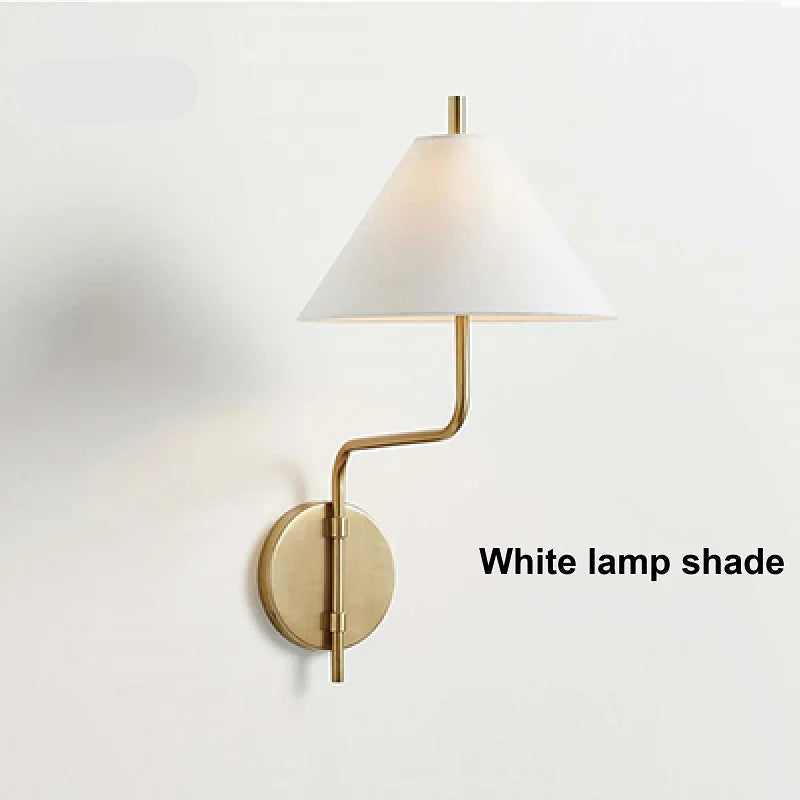 Wall-mounted lamp with white lamp shade and gold arm on a light gray background, featuring the brand 'Huouweii'.