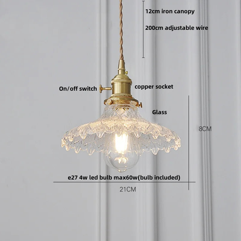 Pendant light with clear glass shade and gold fixture, labeled with features and dimensions on a gray background.