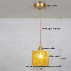 Gold pendant light with labeled parts on a gray background