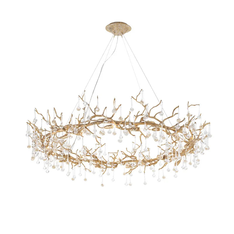 Gold chandelier with branch-like design on a white background