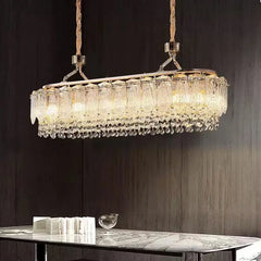 Crystal chandelier hanging above a table with a dark background