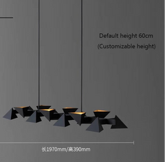 Modern black pendant light with geometric design on a gray background