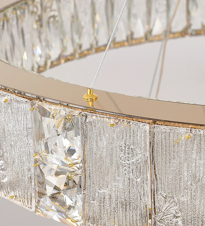 Close-up of a crystal chandelier with gold accents