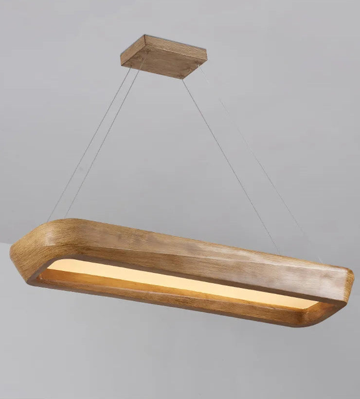 Wooden pendant light fixture on a gray background
