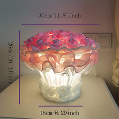 Decorative lamp with floral design and measurements on a neutral background