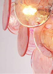 Close-up of a pink and gold ceiling light fixture